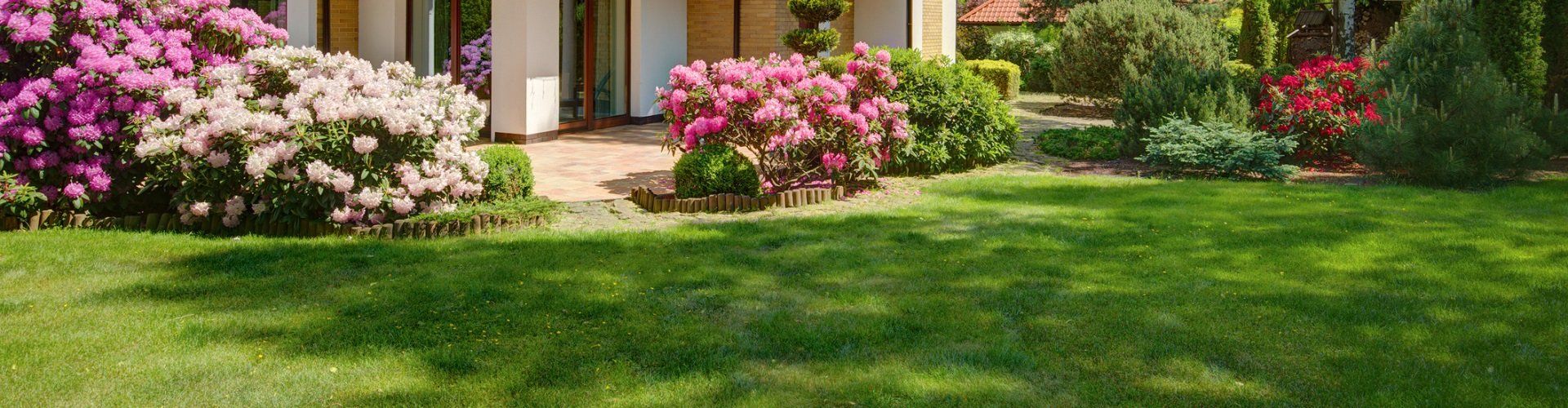 Beautifully maintained front lawn by Another Landscape Company in Brunswick, GA